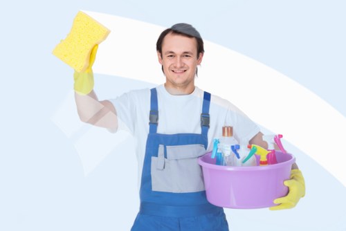 Carpet cleaner preparing equipment safely before starting work